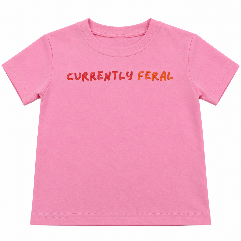 Pink CURRENTLY FERAL kids t-shirt with orange and red lettering